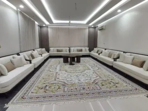 Majlis L1258 cozy living room featuring two couches and a decorative rug on a wooden floor.