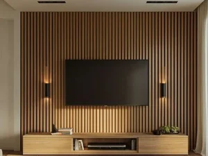 A modern living room featuring a wooden wall tv unit and a flat-screen television, creating a cozy and stylish atmosphere.