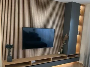 L Shape TV Unit with LED Light modern living room featuring wooden walls and a flat-screen TV, creating a cozy and stylish atmosphere.