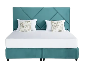 A neatly made Galaxy King Size Velvet Bed featuring a stylish teal blue headboard.