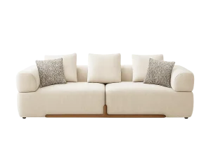 A Oslo 3-Seater Fabric Sofa white fabric, positioned in a room alongside a lamp and a small table.