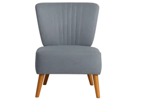 A Grey Upholstered Lounge Chair with a soft light illuminating it, creating a warm and inviting atmosphere.