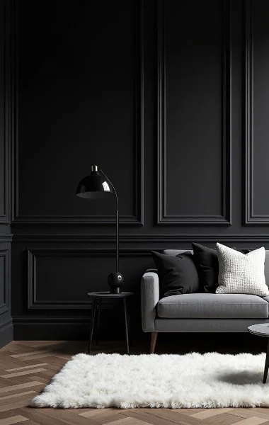 A stylish black living room featuring a modern sofa and a sleek coffee table.
