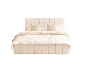 A Wrenley Queen Bed with beige pillows and a white headboard, creating a serene and elegant bedroom atmosphere.