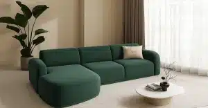 A green sectional sofa in a living room, showcasing a custom sofa bed design available in Dubai.