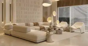 A modern living room featuring custom furniture in Dubai, with elegant white sofas, sleek tables, and stylish lamps for a contemporary interior.