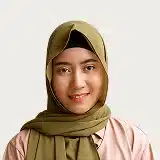 A woman in a hijab smiles warmly, radiating joy and confidence.