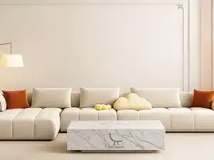 A cozy living room featuring a couch, coffee table, and lamp, illustrating a stylish space for made-to-order furniture in UAE.