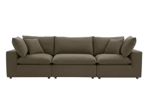 A Cali Chocolate Brown Performance Velvet Modular Sofa adorned with decorative pillows.