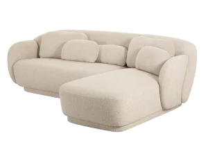 Modern boucle L-shaped sofa with a round design, accompanied by a matching round ottoman.