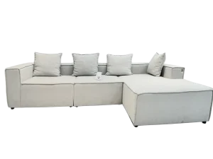 White Luxe Comfort L-Shaped Sofa with chaise lounge, adorned with decorative pillows for a stylish living room setup.